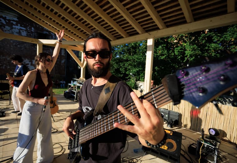 The bassist playing front of stage