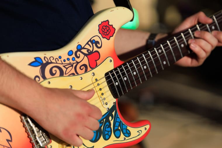 Close detail of the hand-painted guitar